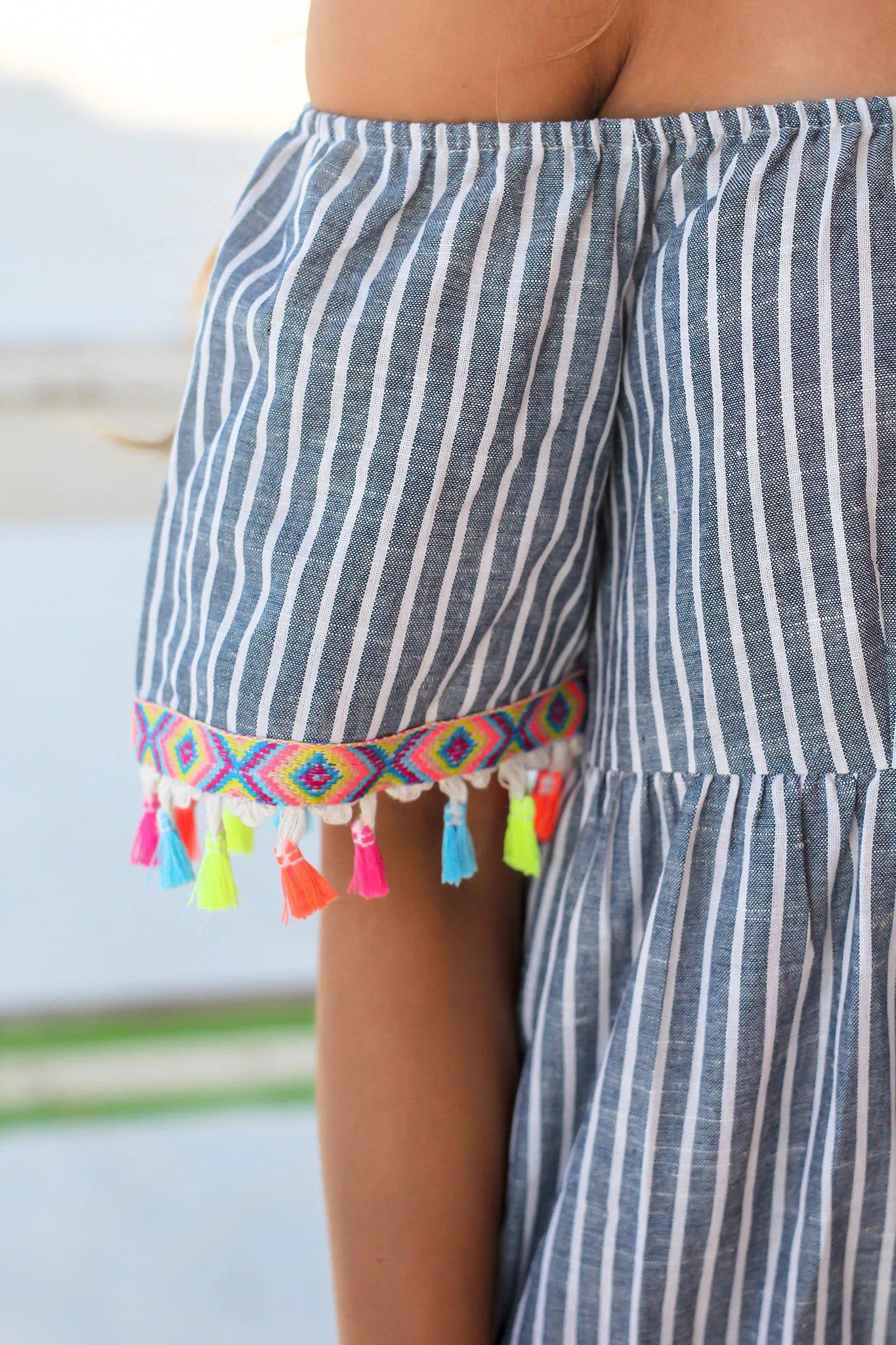 Blue and White Striped Top with Tassel Detail